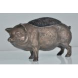 A late 19th / early 20th Century large pin cushion in the form of a pig having repousse decoration