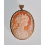 A 20th Century carved shell cameo brooch of oval form set within a 9ct gold mount, the cameo