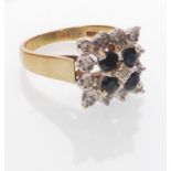 A hallmarked 9ct gold sapphire and diamond cluster ring. Hallmarked London. Weight 4.6g. Size O.