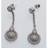 A pair of sterling silver Art Deco style drop earrings set with cubic zirconia and opals. Weight 5.