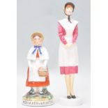 A 19th century Redmaid Bristol Staffordshire figurine together with another Redmaids School Bristol