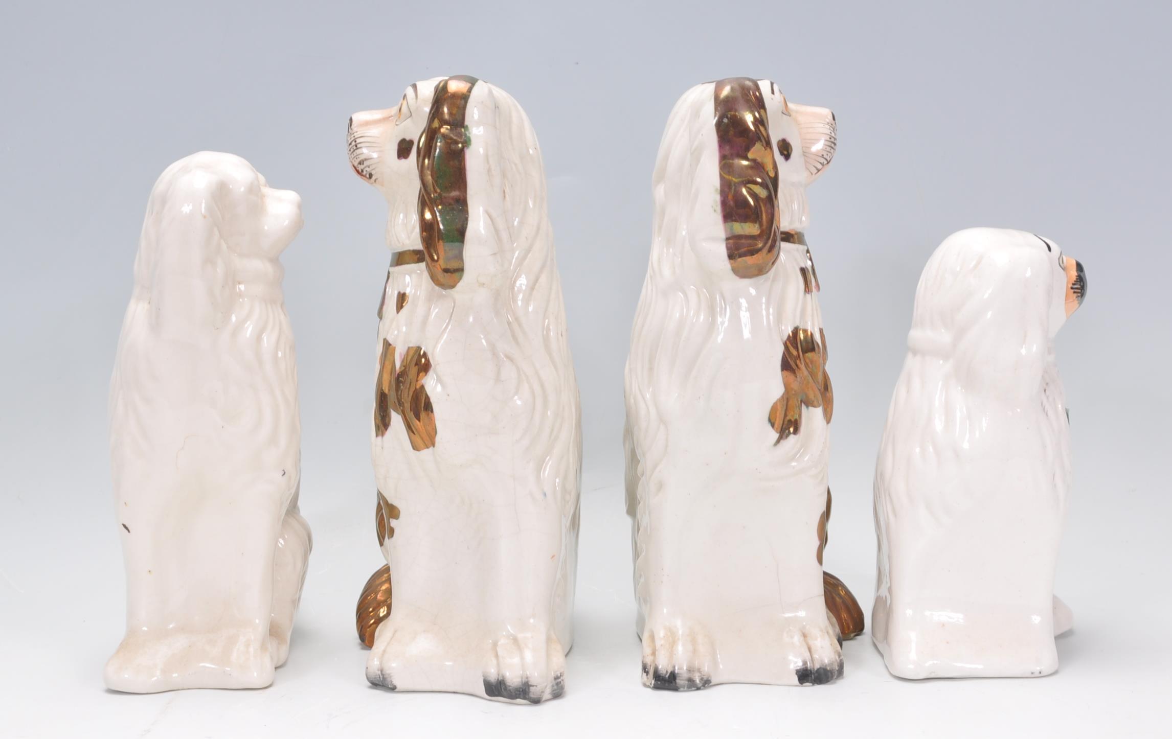 A group of four 19th Century Victorian fire side staffordshire dogs to include two large and two - Image 4 of 7
