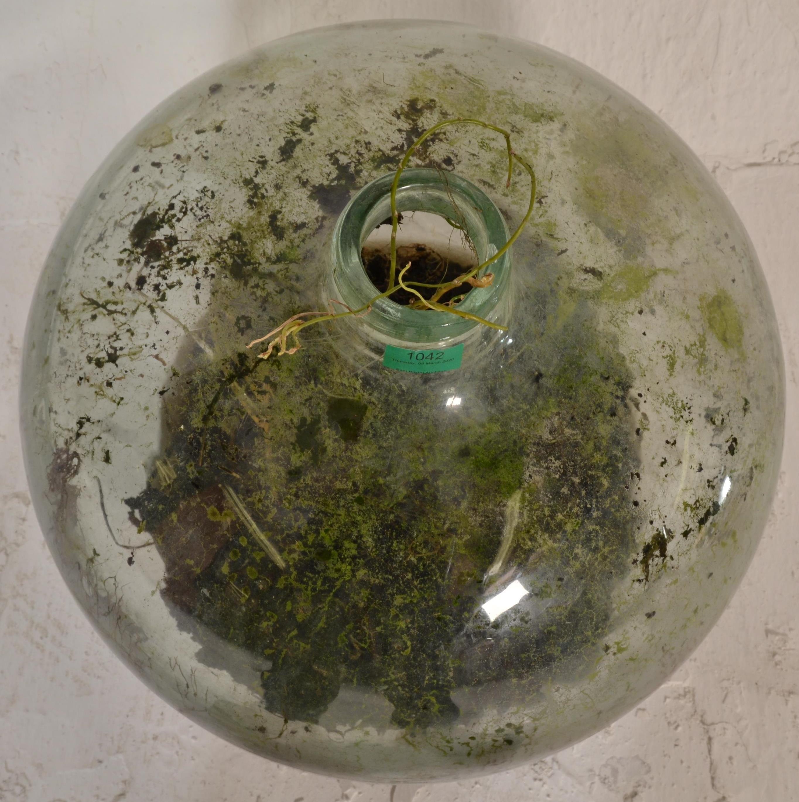 A vintage early 20th century large green glass acid carboy bottle  of globe form with waisted neck - Image 6 of 7