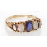 A hallmarked 9ct gold sapphire and opal gypsy ring. Hallmarked Birmingham. Weight 2.9g. Size R.