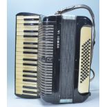 Musical Instruments. A vintage 20th century Hohner accordion  in a black colourway having makers