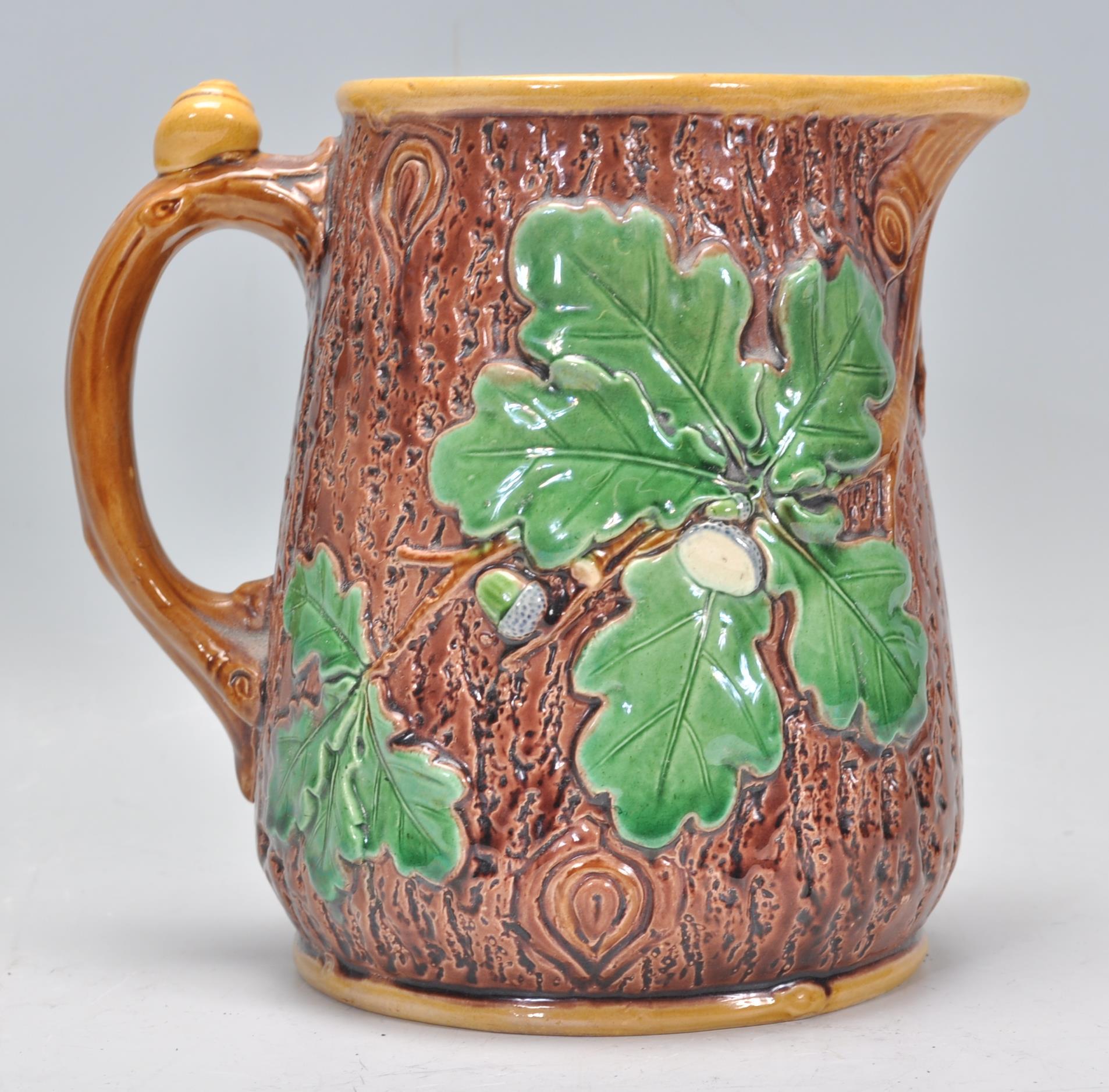 A 19th Century Victorian Mintons Majolica oak jug having a tree bark effect to the exterior with - Image 3 of 6