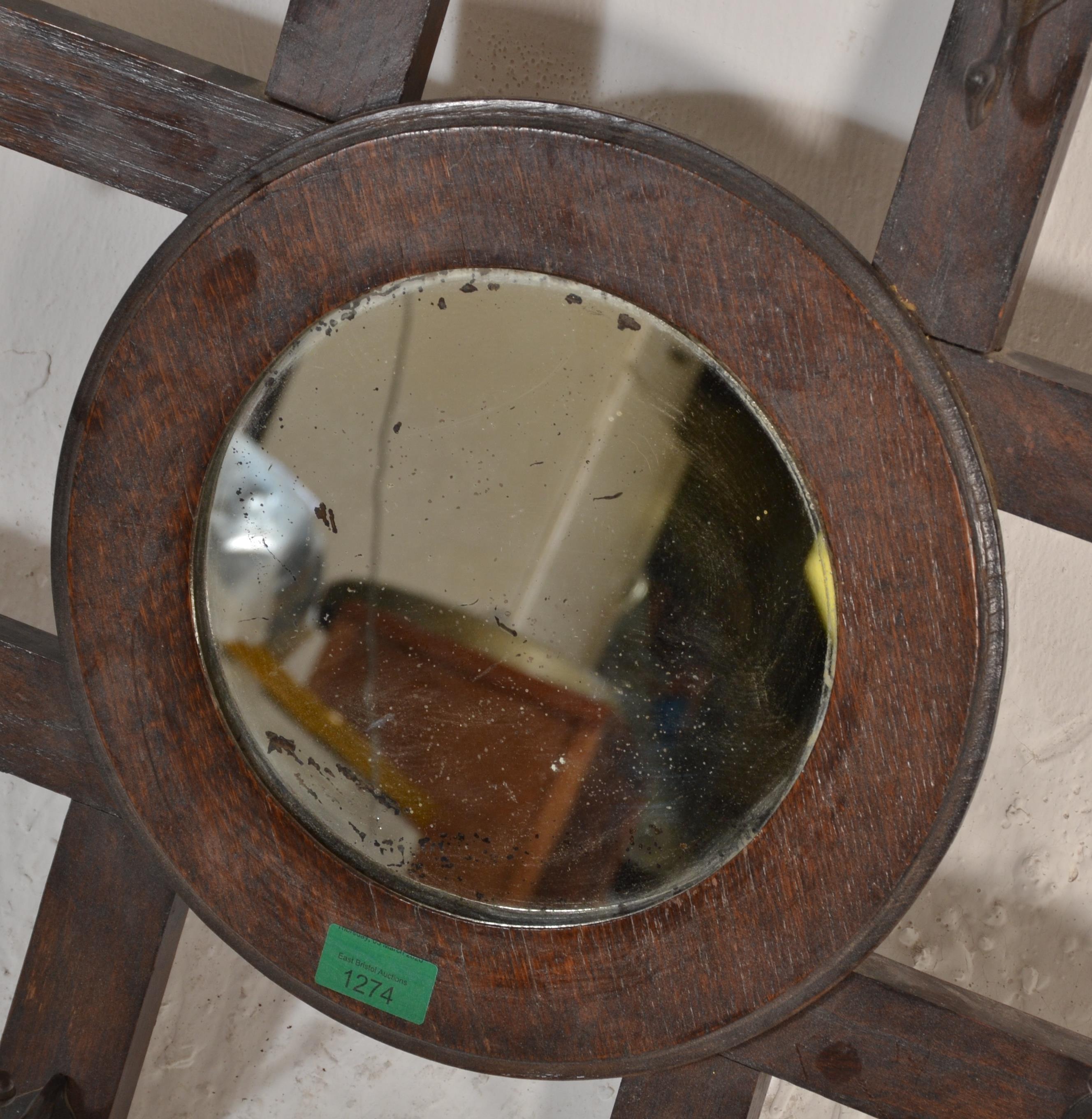 A late 19th century Victorian Arts & Crafts wall mirror coat rack combination. The roundel mirror on - Image 5 of 6