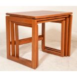 A retro mid 20th Century Danish inspired teak wood nest of graduating tables raised on quadrille