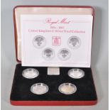 A Royal Mint 1984-1987 United Kingdom one pound silver proof collection in original presentation