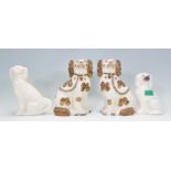 A group of four 19th Century Victorian fire side staffordshire dogs to include two large and two