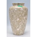 A 20th Century carved green / grey granite baluster vase having a polished finish.