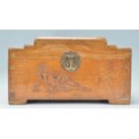 A mid 20th Century Chinese carved camphor wood box casket having a stepped hinged lid opening to