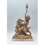 A 20th Century classical style table lamp  in the form of a putto with a goat raised on a