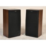 A pair of Sony teak wood cased hi-fi speakers with black facia’s bearing Sony labels. Measures 61 cm