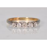 A 9ct yellow gold ladies ring having a platinum mount set with five round faceted cut white