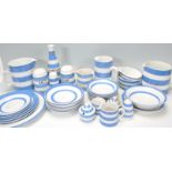 A collection of 20th Century TG Green blue and white striped ceramics to include vinegar decanter,