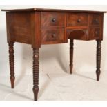 A 19th century George III mahogany bow fronted writing table desk. Raised on bobbin supports