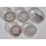 A group of five silver proof coins to include a 1981 Charles and Diana coin, a Diamond Wedding