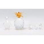 A selection of Swarovski crystal birds to include a penguin, two swans, a duck and a pineapple