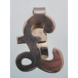 A sterling silver money clip in the form of a pound sign. Gross weight 21.8 grams. Marked 925.