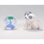 A Royal Copenhagen group figurine of two dogs together with a small Royal Copenhagen Langelinie blue