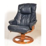 A contemporary Stressless style leather reclining armchair upholstered in a blue leather fabric.