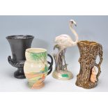 A collection of vintage Art Deco ceramics to include a Sylvac tree stump planter, tree trunk and