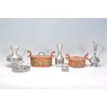 A collection of vintage Norwegian pewter items to include a two jugs, a vase, a chamberstick, and
