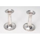 A pair of 1919 Chester hallmarked silver stub candlesticks by J & R Griffin. Each with single