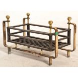 A good 19th Century Victorian iron and brass fire grate. The round brass frame with brass ball