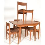A mid 20th Century retro vintage dining suite comprising of an extending dining table raised on