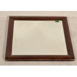 A 19th century Victorian rosewood cushion mirror. The square shaped cushion frame with inset