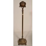 An early 20th Century brass free standing oil lamp