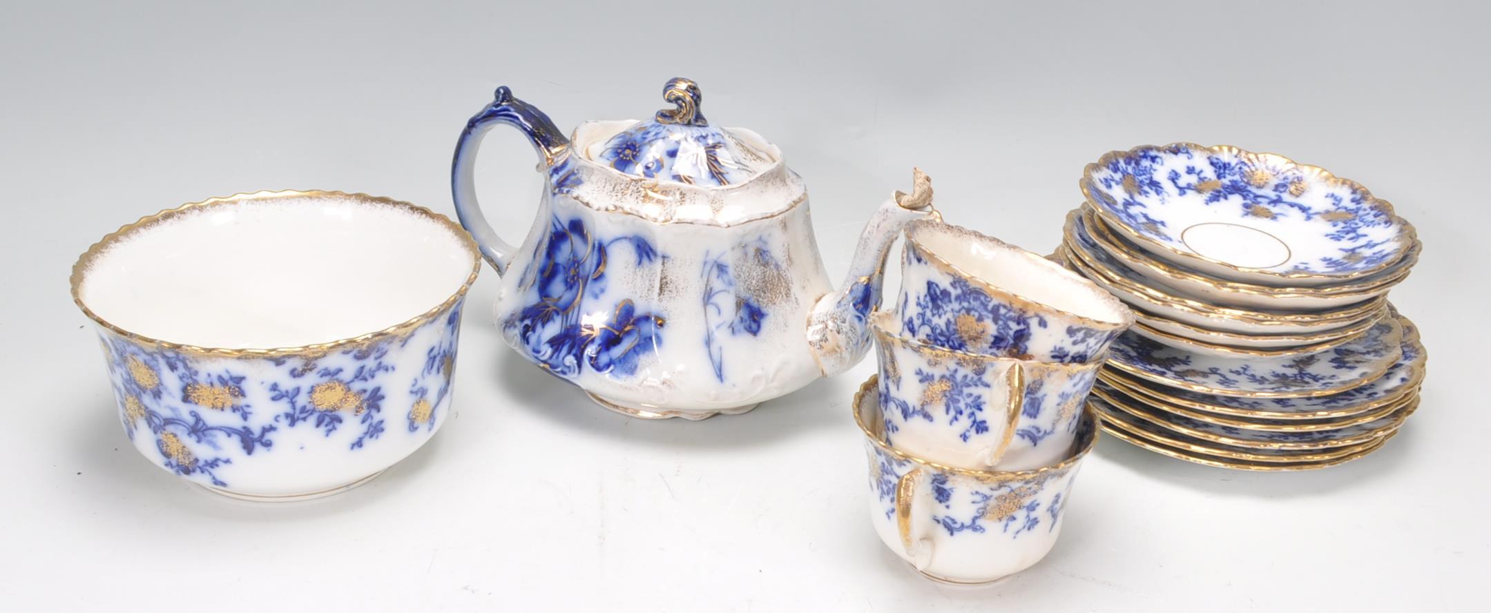 A collection of Victorian 19th century flow blue china to include dinner plates, teapot, cups, sugar