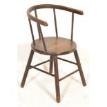 A small late 19th century beech and elm wood country child’s chair with railed back rest and