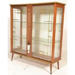A vintage 20th Century wooden bookcase / shelf having glass panelled doors and sides, with two