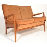 A mid century teak wood Cintique 2 seat sofa settee being raised on a how wood a-frame with