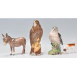 A collection of Beswick porcelain figurines to include a Cuckoo, hound, donkey and an Eagle being