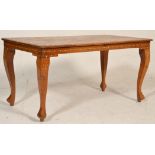 A 20th Century Anglo-Indian coffee table of rectangular form having bone and orange stone floral and
