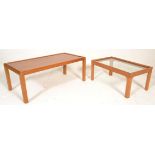 A retro mid century teak wood and re-inforced glass coffee table raised on squared legs together