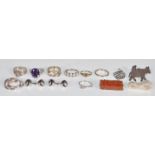 A collection of silver jewellery to include nine silver rings, including a purple stone dress