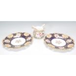 A matching pair of 19th Century Ridgways porcelain plates having decorative scrolled borders with