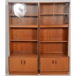 A pair of mid century retro G-Plan teak wood upright cabinets. Each with cupboards to the base