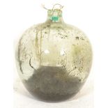 A vintage early 20th century large green glass acid carboy bottle  of globe form with waisted neck