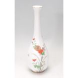 A decorative early 20th century Fukagawa vase of faceted baluster form having hand painted