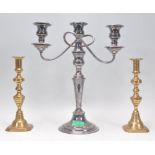 A pair of antique brass candlesticks having knopped columns being raised on square chamfered bases