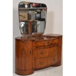 An early 20th Century Art Deco walnut dressing table having a large central mirror above the