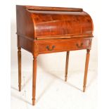 A Regency revival yew wood cylinder ladies bonheur de jour writing bureau being raised on reeded