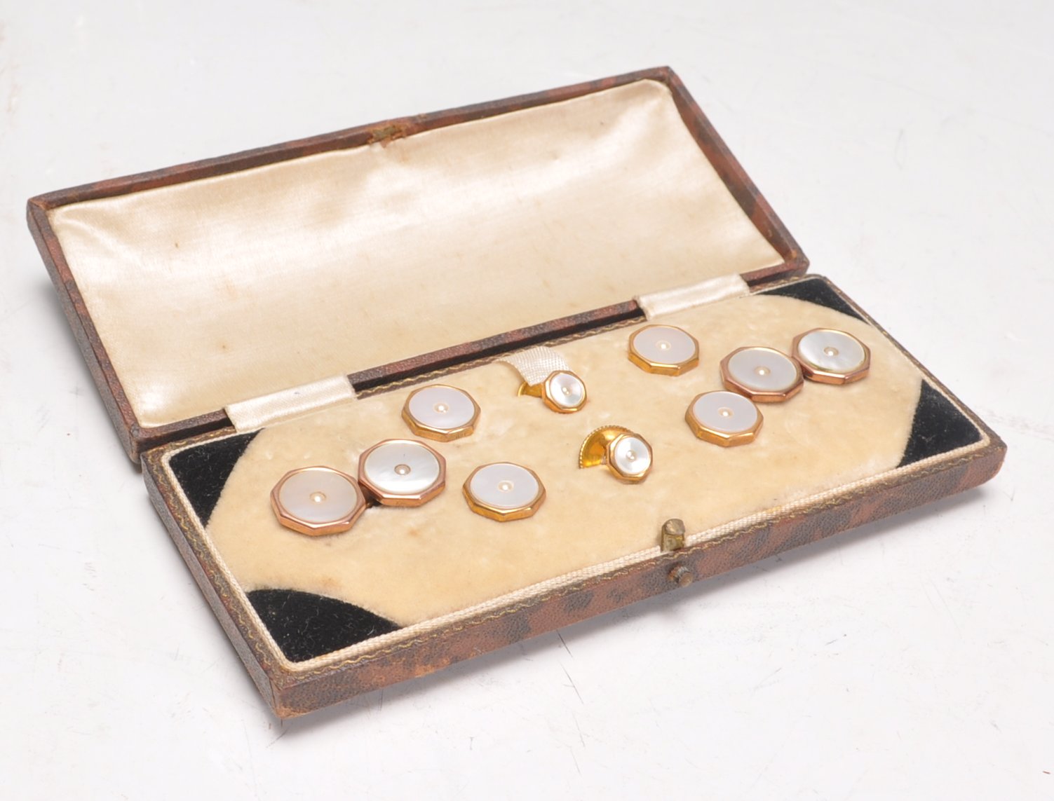 A cased set of early 20th Century 9ct yellow gold octagonal set of dress cufflinks and studs with