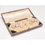 A cased set of early 20th Century 9ct yellow gold octagonal set of dress cufflinks and studs with